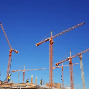 Construction site in Phoenix with workers and cranes
