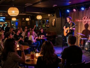 Musician performing during Acoustic Emo Night at The Theodore in Phoenix.