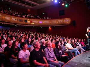 Audience enjoying a comedy performance at the Celebrity Theatre