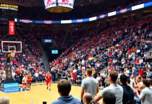 Fans cheering in a basketball arena during a collegiate game