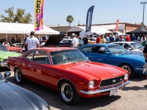 Crowd enjoying Arizona Car Week with collectible cars on display