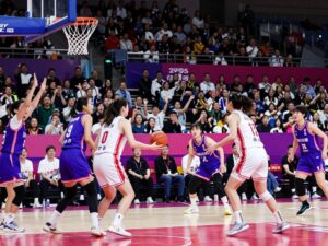 Action shot of the ASU women's basketball team playing against TCU in the arena.