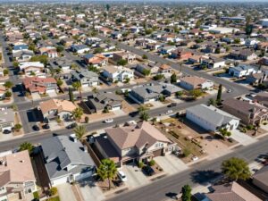 Aerial view of homes in Chandler, Arizona displaying various architectural styles under a clear sky.