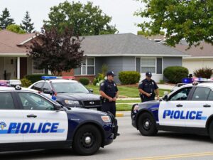Police vehicles in a Chandler neighborhood during an emergency response.
