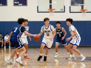 High school basketball players in action during a game in Dallas