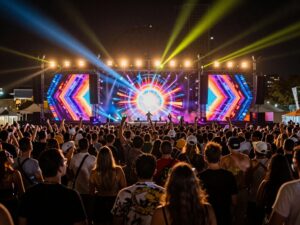 Lively crowd enjoying electronic dance music at Dim Mak Takeover festival in downtown Phoenix.