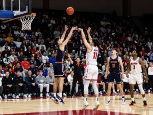 GCU Lopes basketball team making a three-point shot during a game
