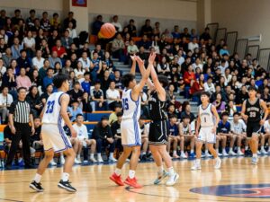 High school basketball players competing during a game