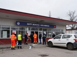 Aftermath of missile attack at a postal terminal in Kharkiv, emergency responders at work.