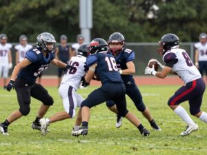 Millennium Tigers celebrating victory in a high school football match.