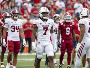 College athletes in uniforms featuring commercial logos