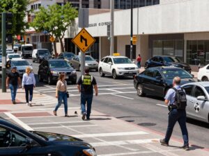 Busy urban intersection in Phoenix highlighting pedestrian safety issues.