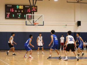Phoenix Christian basketball team displaying teamwork during a game