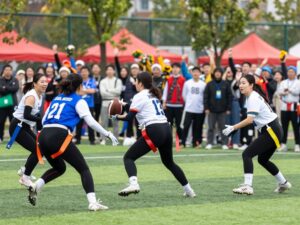 Image of female athletes participating in a collegiate flag football game at Arizona State University.