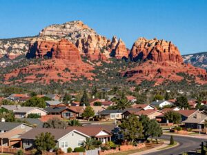 A beautiful view of Sedona, Arizona highlighting homes and red rock formations