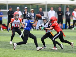 Young athletes participating in a 7-on-7 football tournament
