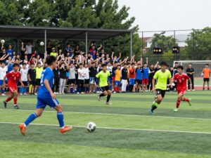 High school soccer players in action during a playoff match