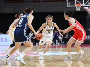 Women's basketball players in action during a game