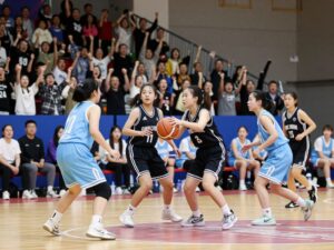 Copper Hills High School girls basketball team celebrating their playoff victory.