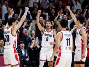 Grand Canyon University men's basketball team celebrates their victory.
