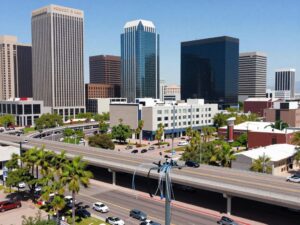 Phoenix city skyline with fiber optic cables symbolizing enhanced digital connectivity.