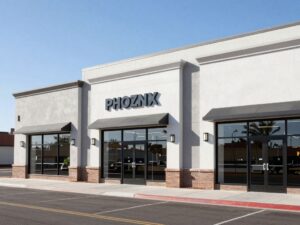Three identical, modern retail buildings in Phoenix, Arizona, showcasing successful commercial development through prefabricated steel construction.